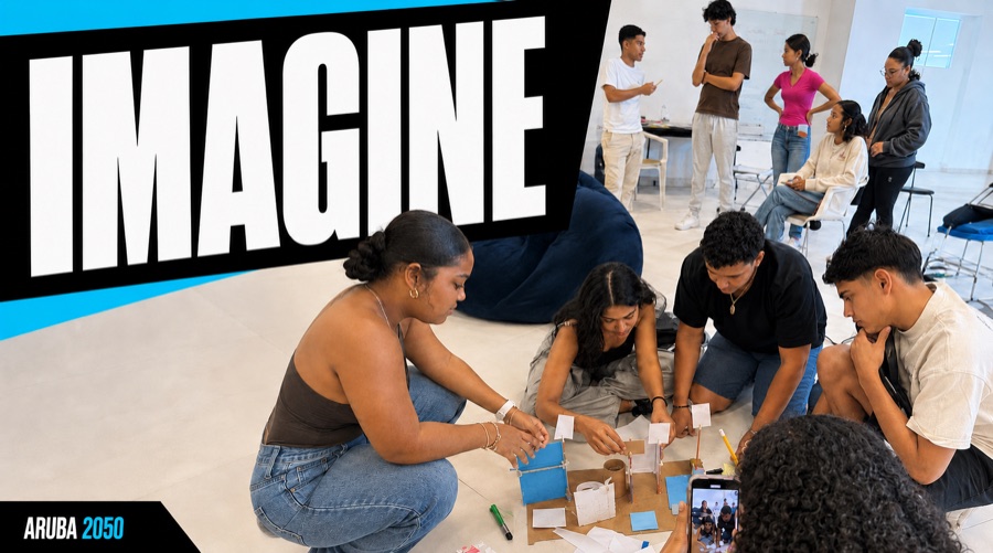 Young Arubans building a prototype together on the floor while one films it.